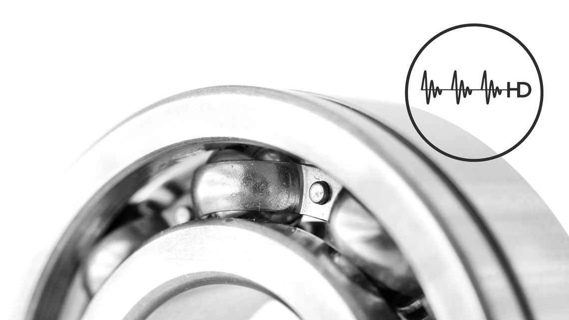 Close-up of ball bearings in gray and white with a small circular HD symbol to the right